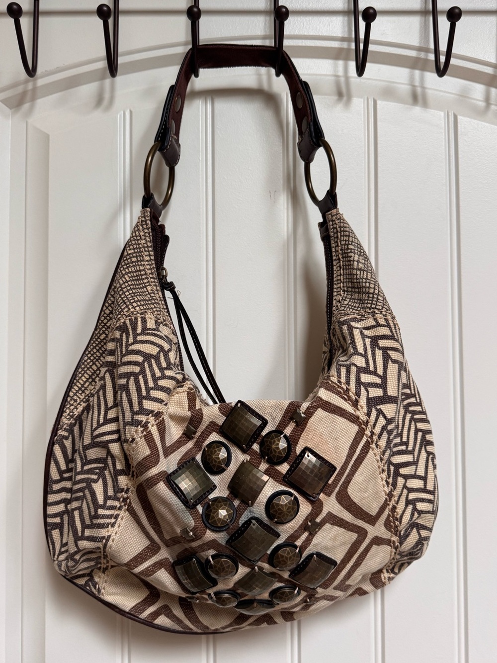 Fossil Ari Embellished Beige and Brown Canvas Hobo Bag. 17” by 11” by 0.5”